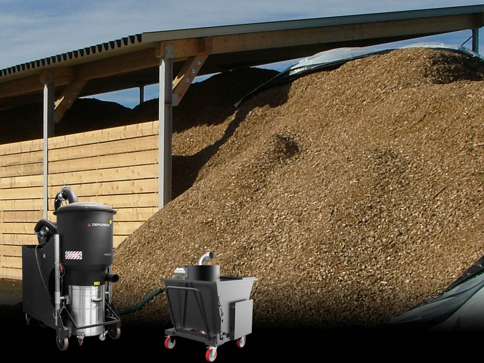 Depureco industrial vacuum with hopper separator handling biomass wood chips at storage bay